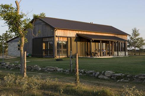 This pole barn home features an open floor plan with kitchen and ...